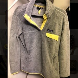 Yellow and gray Patagonia pull over.